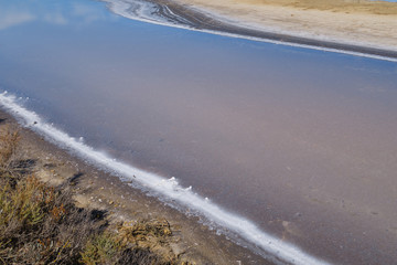 Fototapeta premium Old craft saltworks, sea water, in Chiclana de la Frontea, Cadiz, Spain