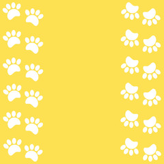 Paw prints animal white on yellow background with copy space for text.