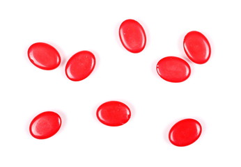 Red candies isolated on white background, top view