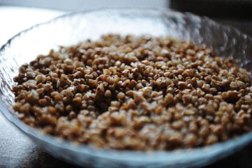 A large plate of boiled buckwheat groats close-up