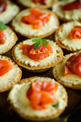Tartlets with cheese filling and salted salmon meat