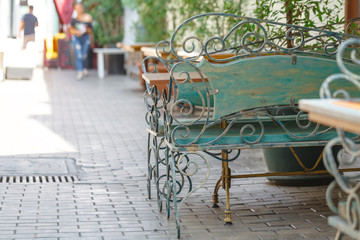 Beautiful old bench in street cafe