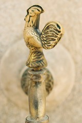 Tapestry design, brass cock