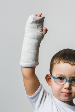 Brave Kid Showing the Arm Cast
