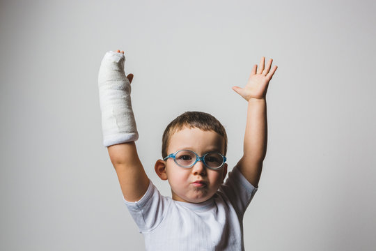 Brave Kid Showing the Arm Cast