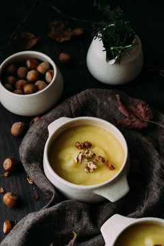 Homemade delicious creamy soup topped with hazelnuts