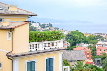 Beautiful evening sunset view from top to Santa Margherita Ligure city. Blue sky and colorful buildings. Italy beauties.