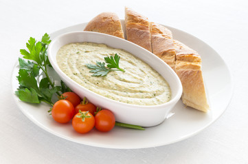 eggplant dip with bread,cherry tomatoes and parsley