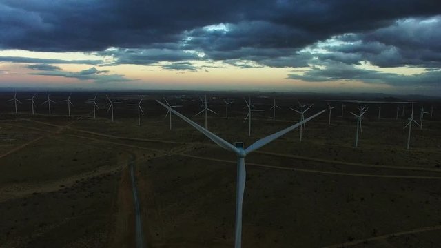Windmills generating clean renewable energy at dawn