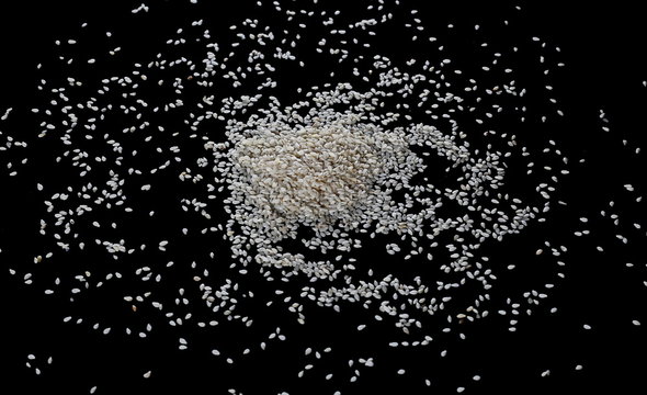 Pile sesame seed isolated on black background, with clipping path