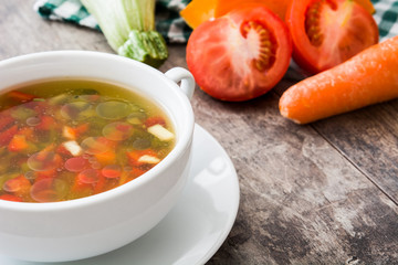 Vegetable soup in bowl on wooden table
