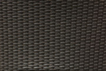 Black rattan weave texture.