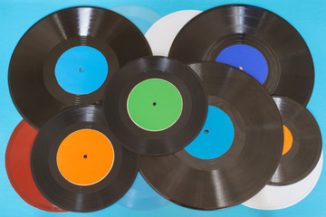 Old vintage vinyl records on the blue background.