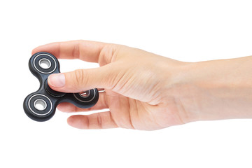Hand holding Black Fidget Spinner isolated on white background