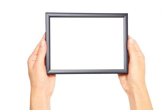 Decorative black photo frame in hand isolated on white background