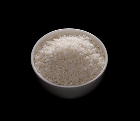 Rice pile in white bowl isolated on black background