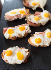 Kroc madam, bruschetta with fried Quail egg and jamon