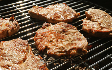 Tasty steaks on barbecue grill