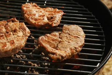 Tasty steaks on barbecue grill