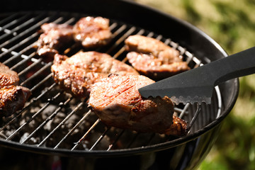 Tasty steaks on barbecue grill