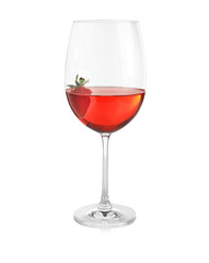 Glass of delicious strawberry wine on white background