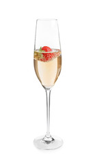 Glass of delicious wine with strawberry on white background