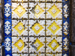 White, yellow and blue traditional portuguese tiles (azulejos) with relief