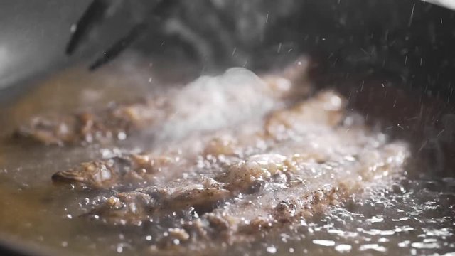 Capelin is fried in the hot boling olive oil, crispy fried fish, cooking seafood, dishes with fish