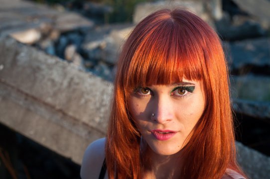 Red head sexy streaptease girl urban concrete destruct landscape