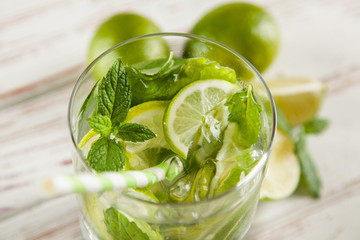 Mojito cocktail on white wood background