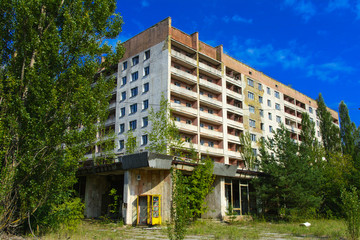 Old abandoned high-rise buildings in a dead radioactive zone. Looting and vandalism. Consequences of the Chernobyl nuclear disaster, August 2017.