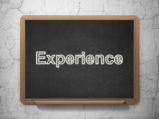 Business concept: Experience on chalkboard background