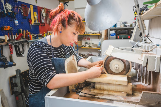 Artisan Woman Cutting Stone with a Circular Saw for Mosaic Artwo