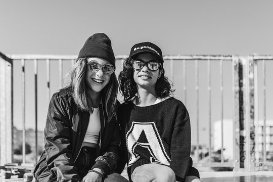 Two teen-age hipster girls smiling