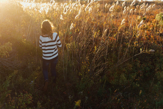 teen standing in cat's tails