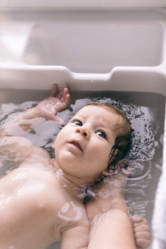 Baby taking bath