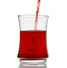 Pouring black tea isolated on white background.   