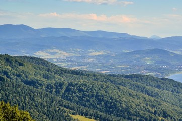 Summer mountain landscape. Beautiful green hills on a sunny day.