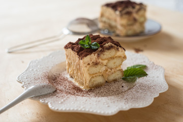 Tiramisu coffee cake served on a white plate