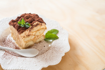 homemade tiramisu cake on wood background