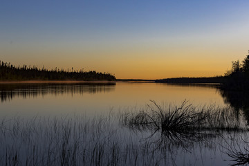 Sunset on the Winisk River in Northern Ontario. The Winisk flows through Ontario's ring of fire before emptying into Hudson's Bay. 