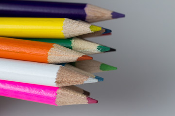 Fototapeta premium Close-up of a group of multicolored pencils on a white background