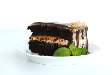 isolated Slice of chocolate birthday cake on white background