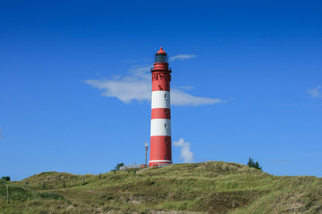 Fototapeta na wymiar Lighthouse on the German North Frisian island of Amrum
