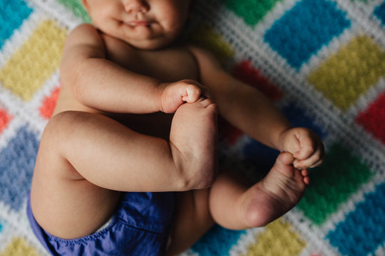 Baby lying on blanket