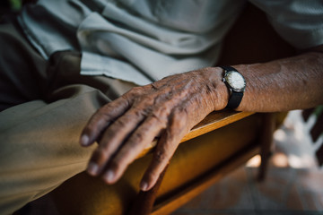 Close up of senior man hand with a watch
