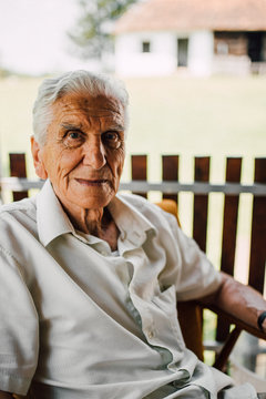 Portrait of a senior man sitting on the terrace