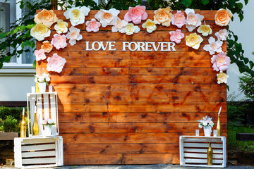 Inscription love forever on wooden boards. Beautiful wedding wooden arch. Wedding day.