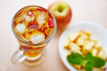 A glass of apple drink with mint