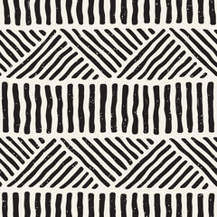 Hand drawn style ethnic seamless pattern. Abstract geometric tiling background in black and white.